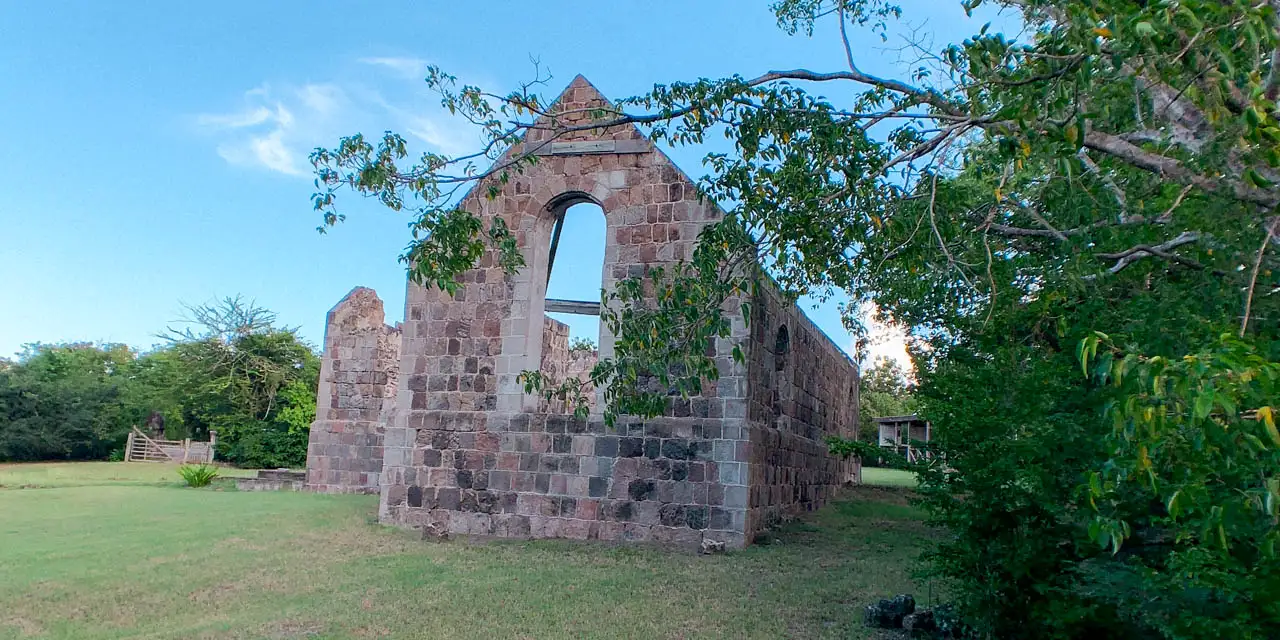 Shell of Anglican church ruins with no roof