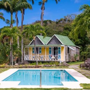 Gingerbread cottage and pool at Hermitage Nevis