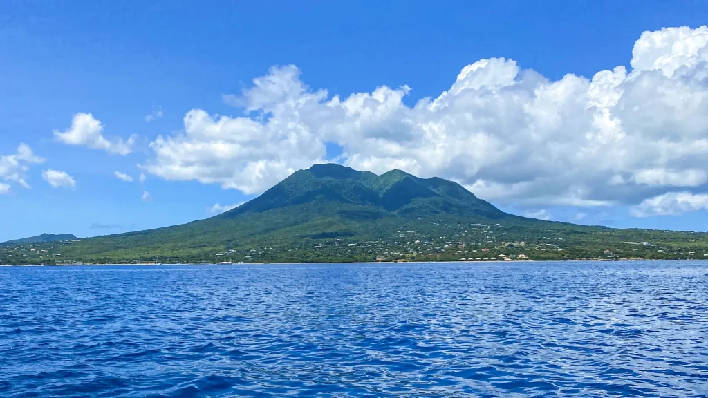 Nevis Peak rising above the sea, seen on the crossing from St. Kitts to Nevis