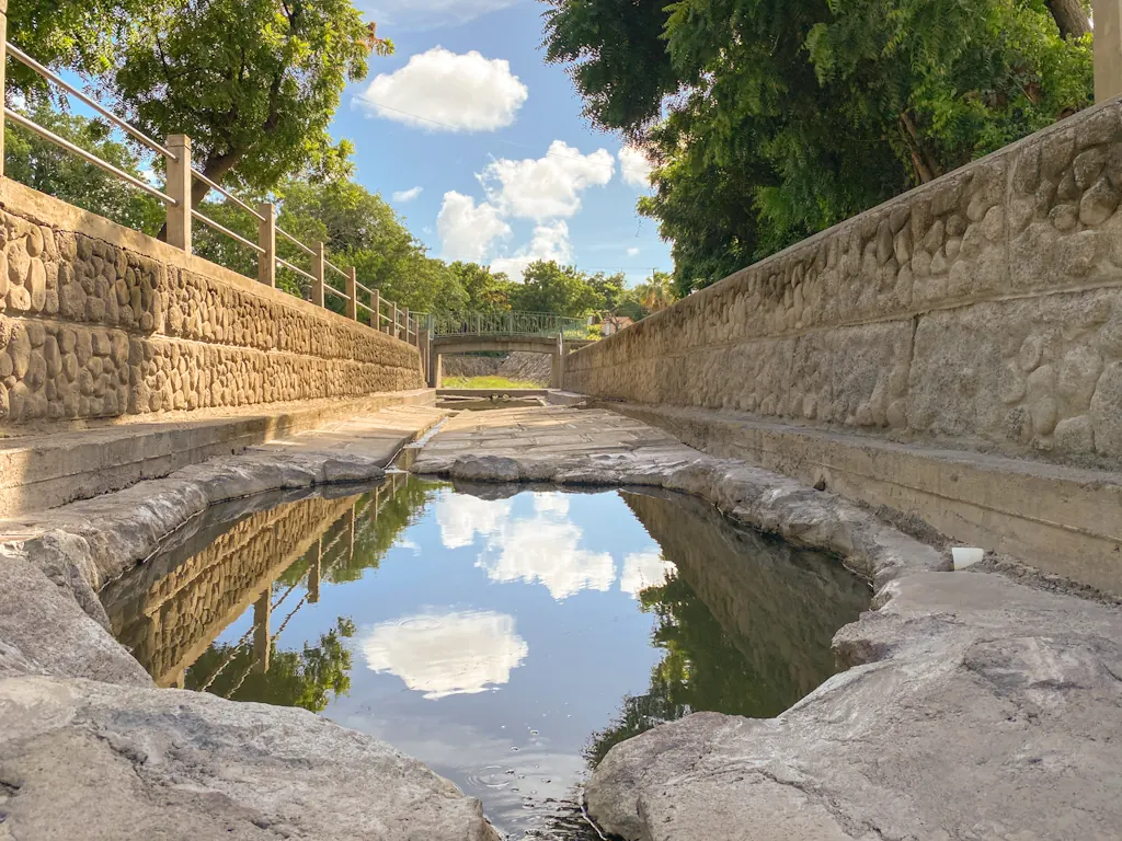 Stone-lined soaking pool at the Nevis Hot Springs in Bath Village