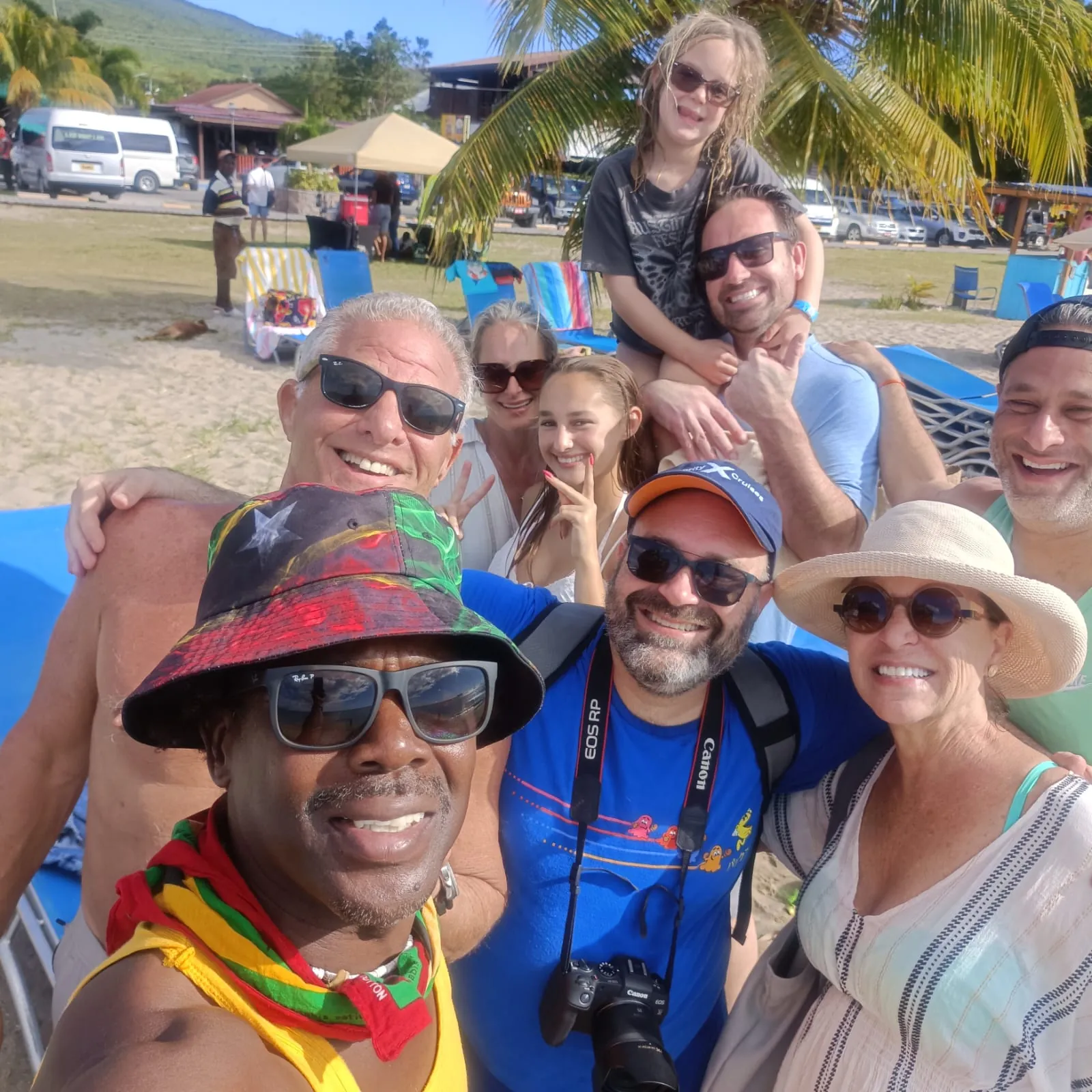 A Book Nevis cruise group with Ganzies, the owner, at his beach bar on Pinney's Beach, Nevis